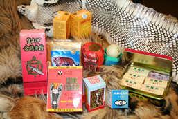 Various products of the traditional Asian medicine: whole tiger skin, cobra skin, capsules in boxes, bandages, ointments.